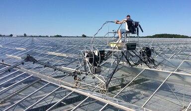 apply protective coating to glass greenhouse