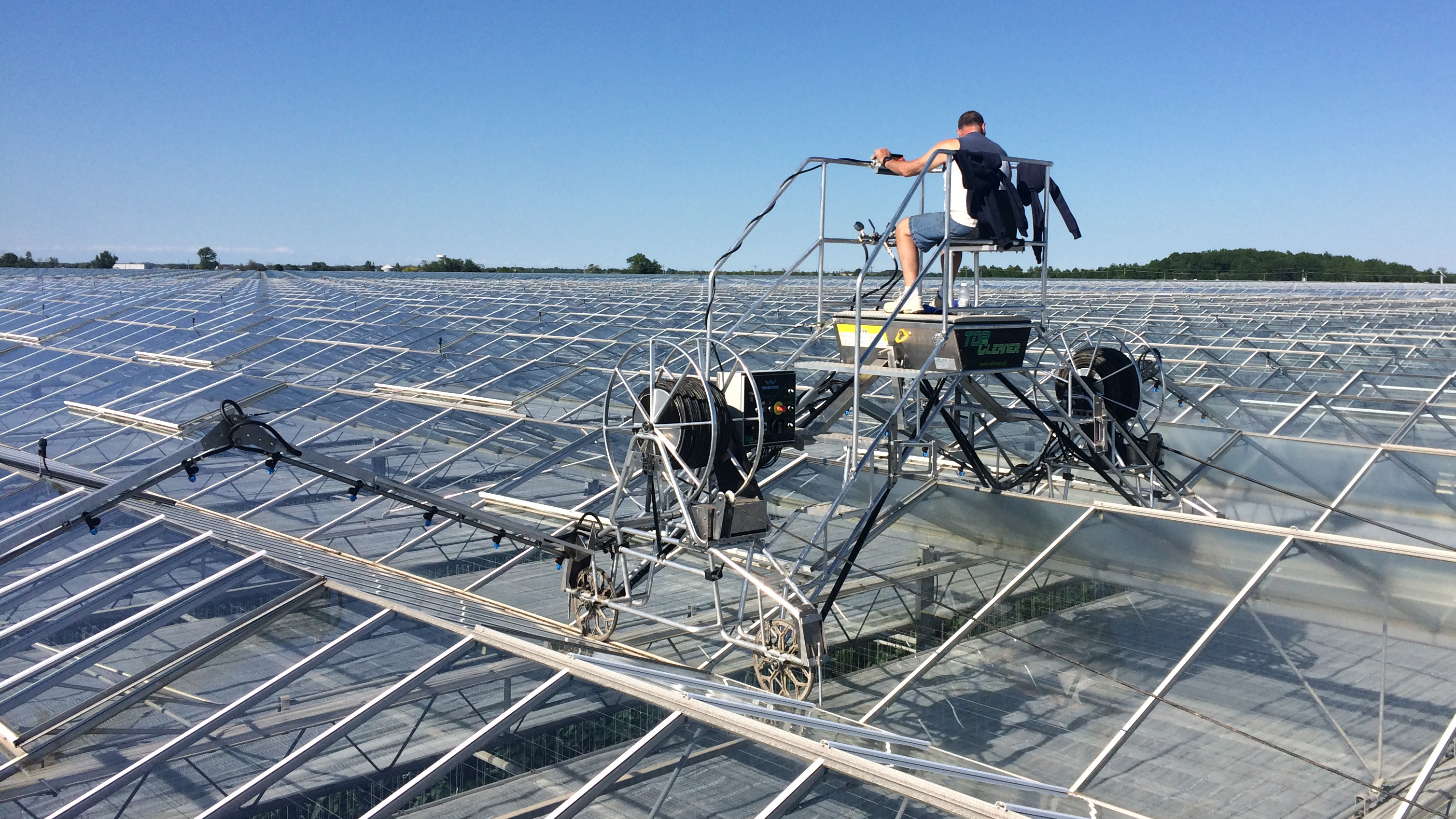 apply protective coating to glass greenhouse