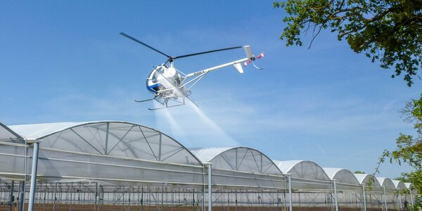 Helicopter application of shading agent