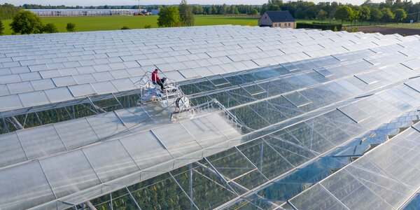 Machine application of ReduFuse IR on glass greenhouse