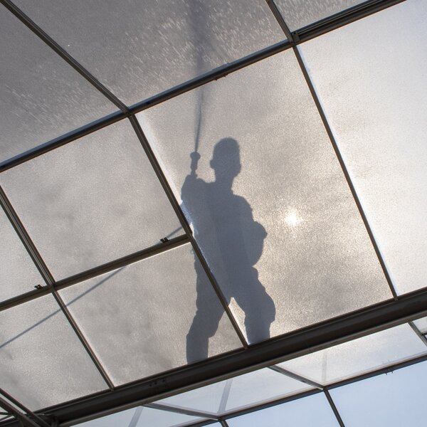 Manual application shading agent on glass greenhouse